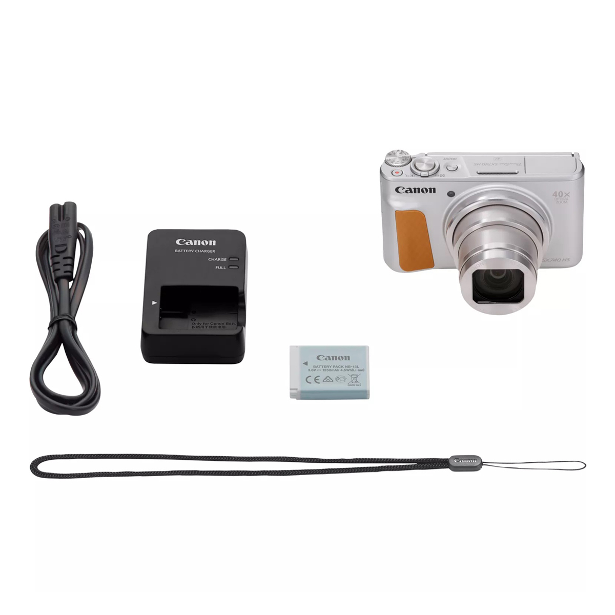 Canon PowerShot SX740 HS Kompaktkamera in Silber mit Zubehörset aus Akku, Ladegerät, USB-Kabel und Handschlaufe auf weißem Hintergrund.